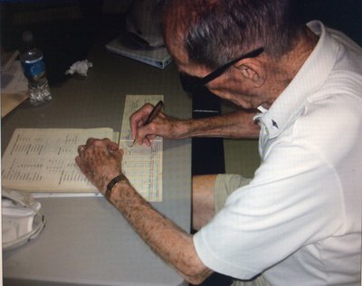 Cessna Production Test pilot Mort Brown re-signing the first entry in the airplane logbook